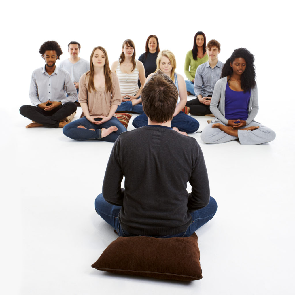 meditation teacher meditating with a group of people - The Science of ...